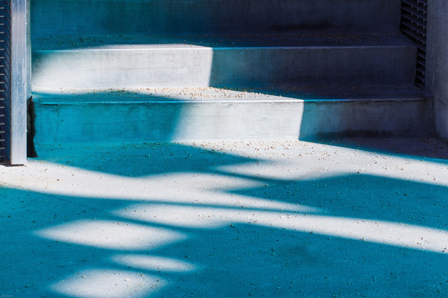 Sunlit concrete steps rendered in deep blue