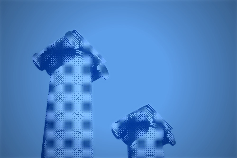 A fluted column and fallen capital, blue duotone
